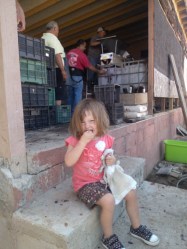 Maya samples grapes before they get crushed