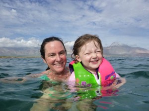 Brave Maya swimming with whale sharks all around!