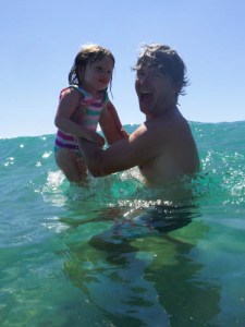 Maya jumping the waves with Brian